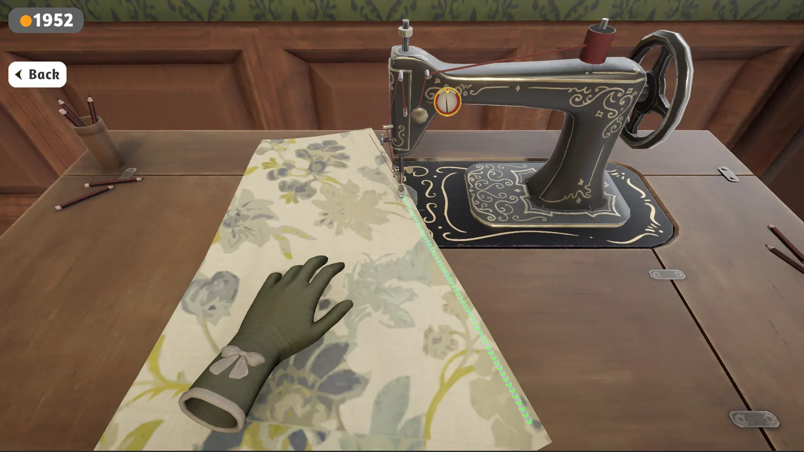 Treadle sewing machine stitching a printed cotton panel