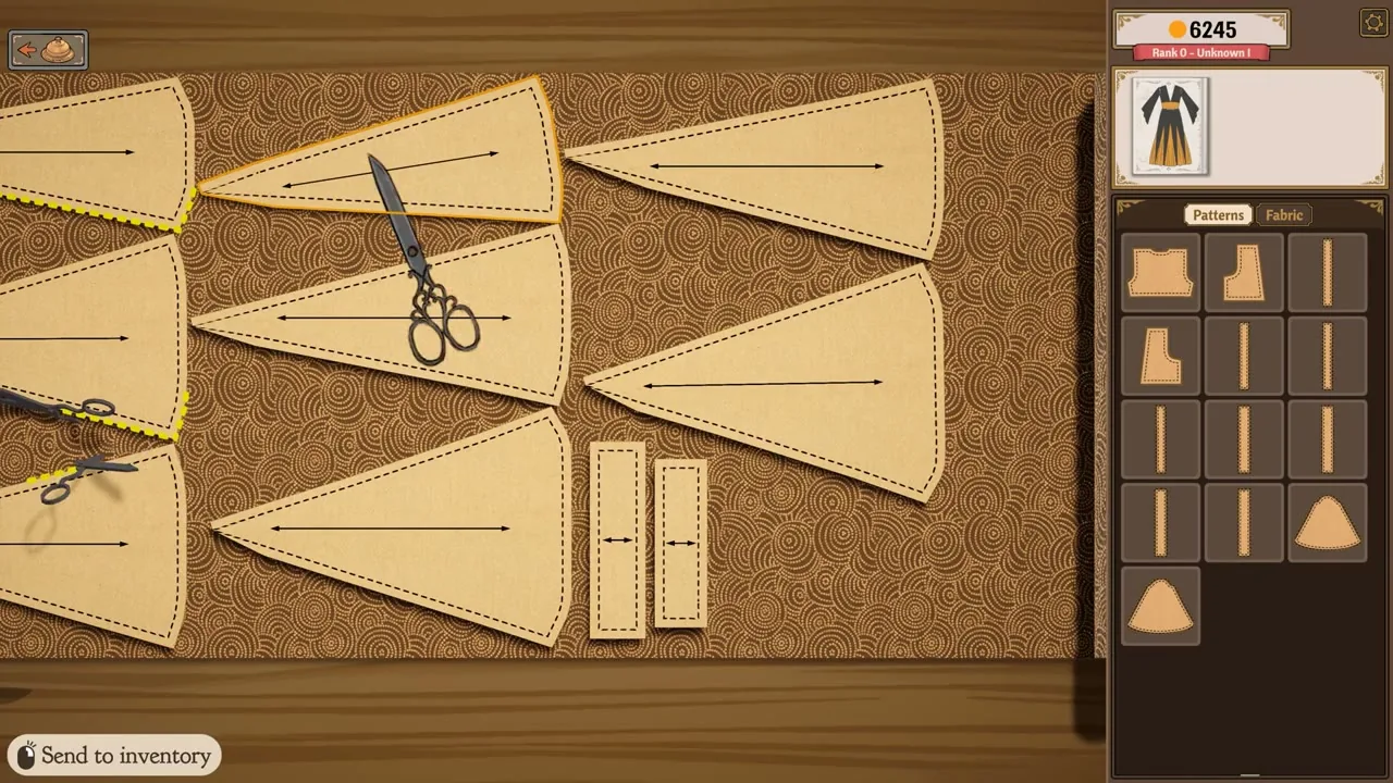 Pattern pieces spread across the cutting table beside the dress form