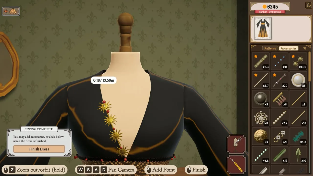 Dress form close-up with a pinned lace trim running along the neckline seam